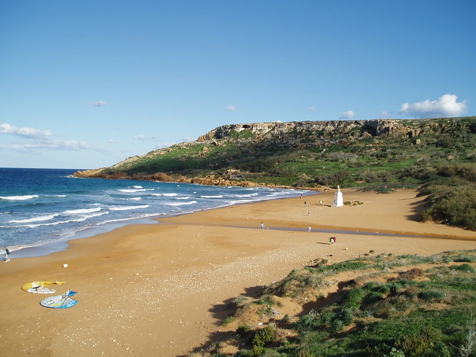 Sunny view across Ramla Bay and its red sand